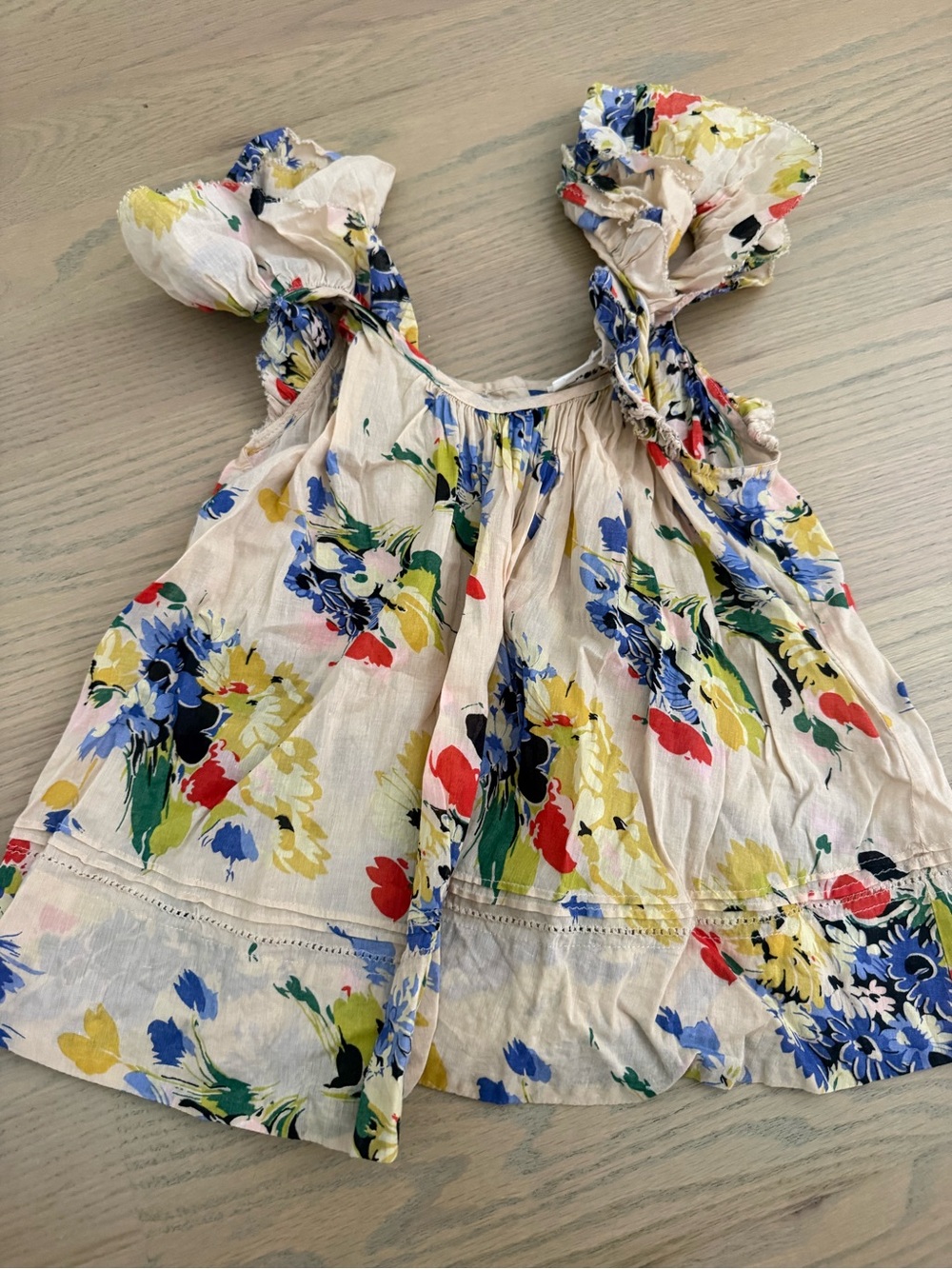 THE GREAT. Cream Floral Ruffle Strap Tank with Blue, Yellow & Red Blooms